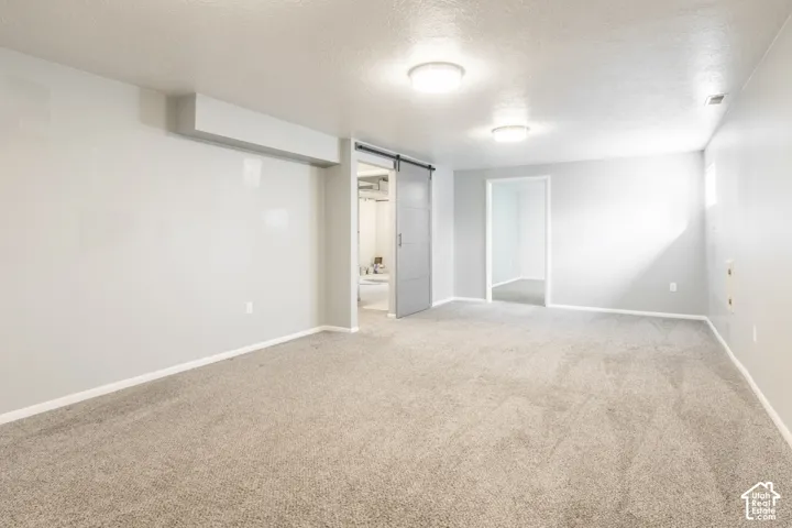 Large lower-level family room with plenty of space to spread out.