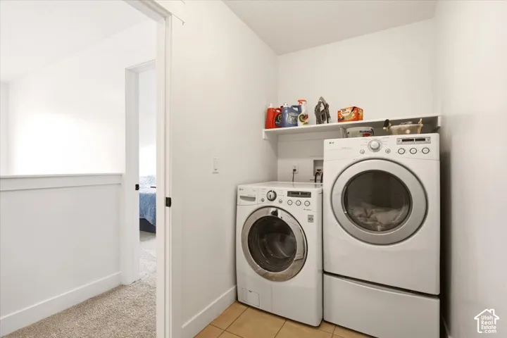 Laundry area with tile flooring.