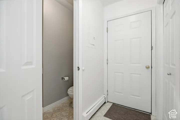 Six-panel interior doors, neutral interior paint palette, and patterned resilient flooring