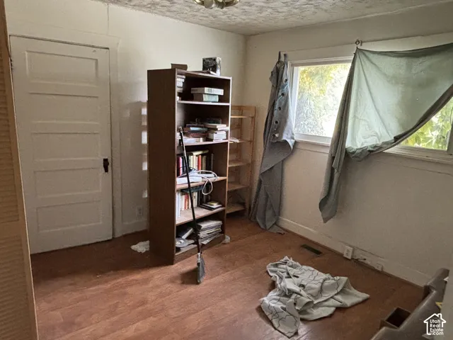 Wood-finish flooring, multi-pane window, and four-panel interior door