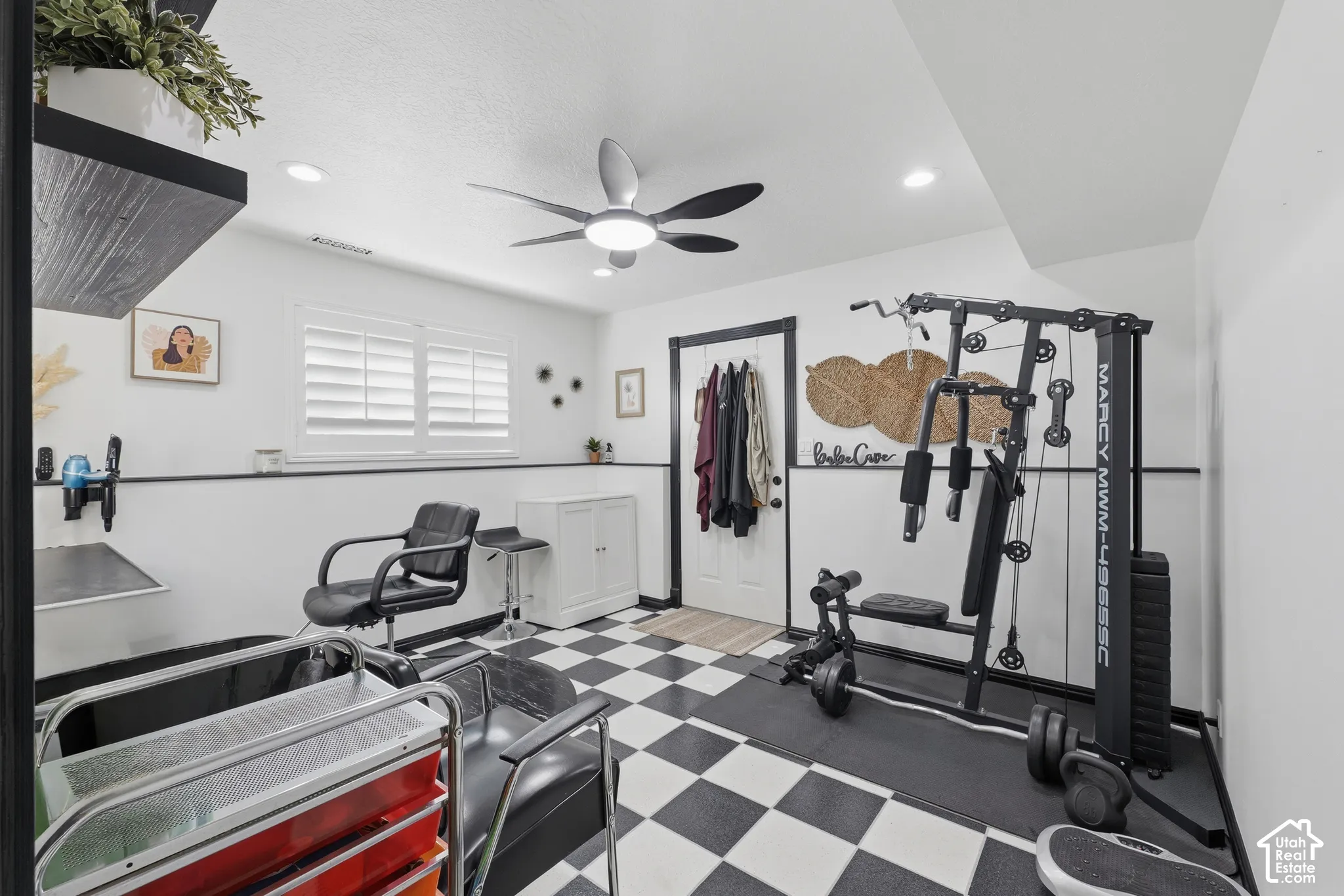 Checkered vinyl flooring, recessed lighting, ceiling fan with integrated light fixture, window shutters, and built-in shelving