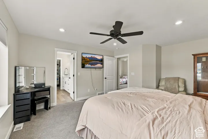 Neutral-toned room featuring recessed lighting, a multi-blade ceiling fan, and wall-to-wall carpeting