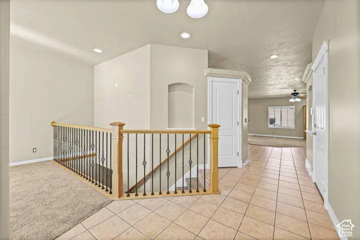 HALLWAY AT ENTRY OF GARAGE AND FRONT DOOR