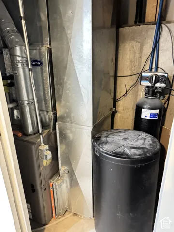 Carrier furnace unit with metal ductwork, paired with a water filtration and softening system