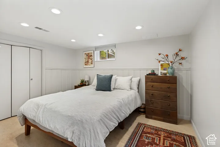 Room featuring recessed lighting, beadboard wainscoting, and a double-door closet