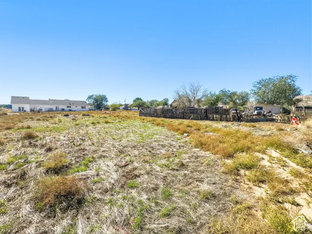 Expansive lot featuring open terrain and mature trees