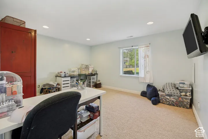 Room featuring wall-to-wall carpeting, recessed lighting, and a single-pane window