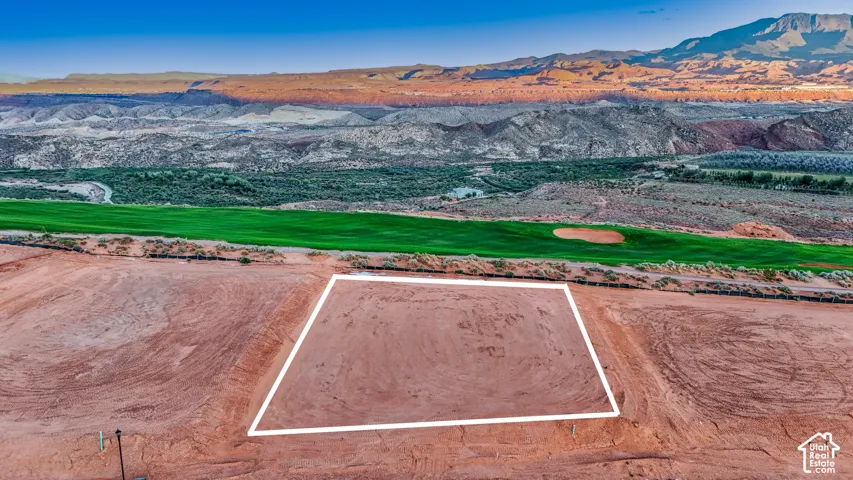 Expansive vacant lot featuring mountain scenery and direct proximity to a golf course