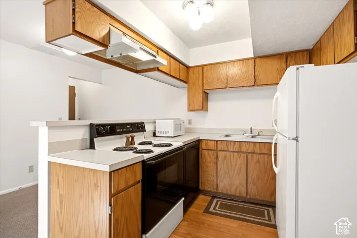 electric range, and wood-finish flooring