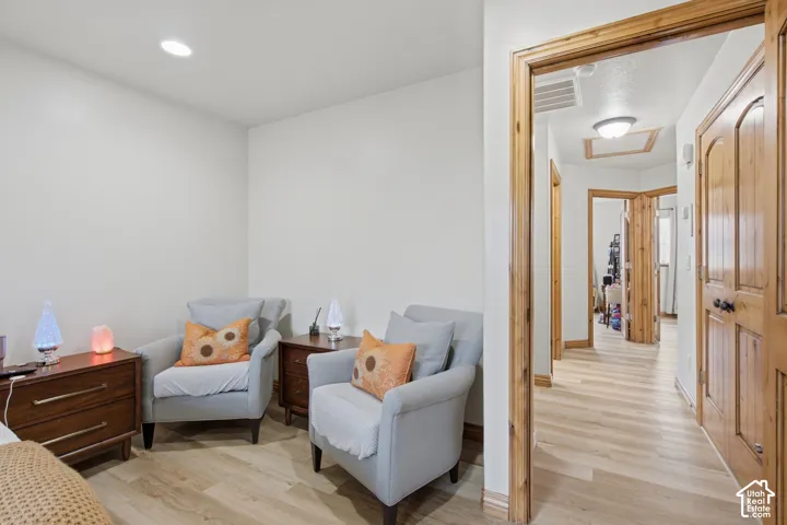 Wood-finish flooring, natural wood door casing, solid-core wood doors, and recessed lighting
