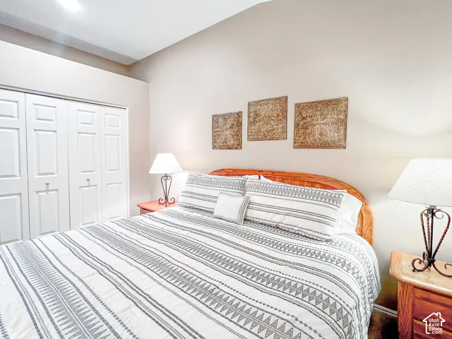 Vaulted ceiling and bi-fold closet doors with raised panels