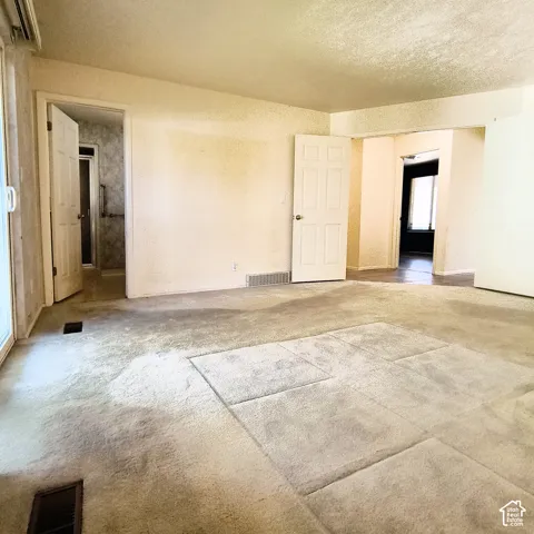 Master bedroom with walk in closet multi-panel doors, and sliding glass entry to covered deck