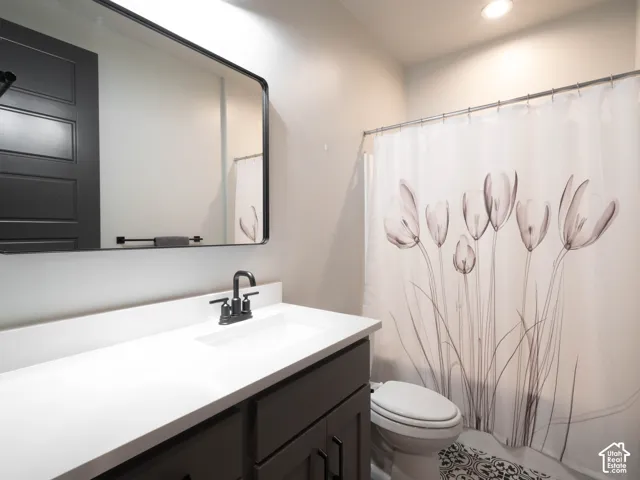 White countertop with an integrated sink and a matte black faucet