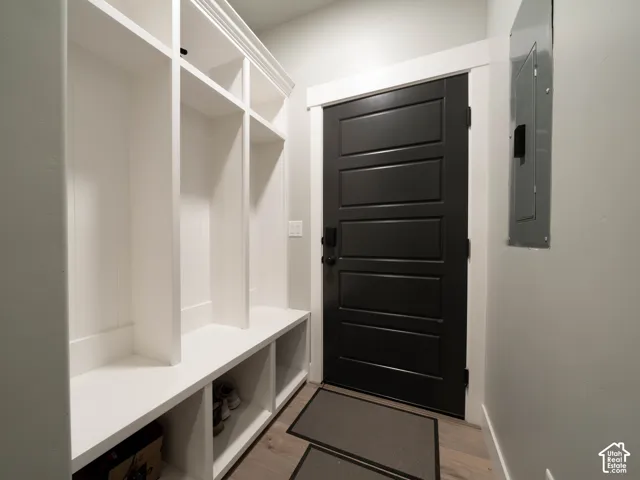 Built-in white storage cubbies with bench seating