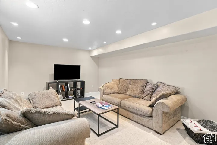 Neutral-toned interior space featuring recessed ceiling lighting and wall-to-wall carpeting