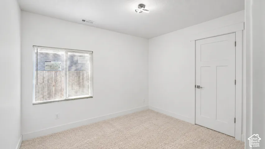 3rd bedroom. Digitally altered to show new carpet.