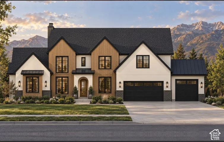 Multi-gabled exterior featuring wood-finish siding, light-toned stucco, black metal roofing, and mountain backdrop