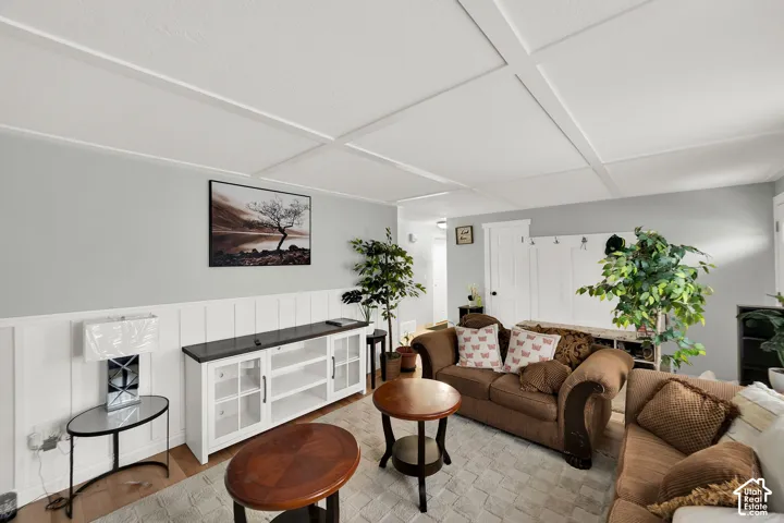 Coffered ceiling, board-and-batten wainscoting, and built-in wall cabinetry