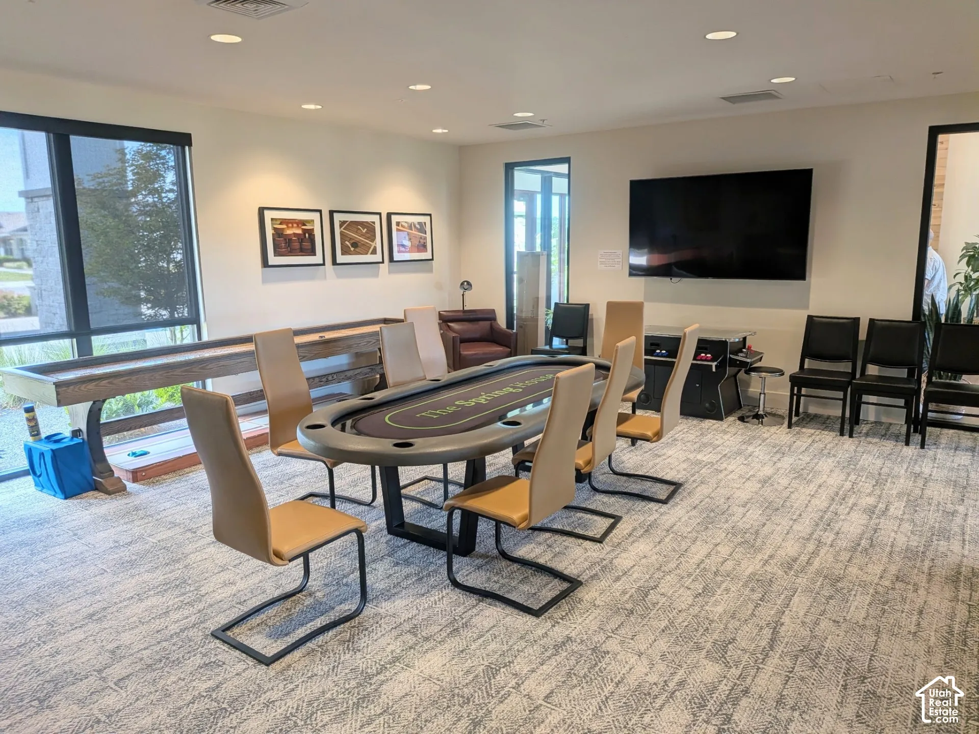 Recreation room featuring recessed lighting, large windows, and wall-to-wall carpeting