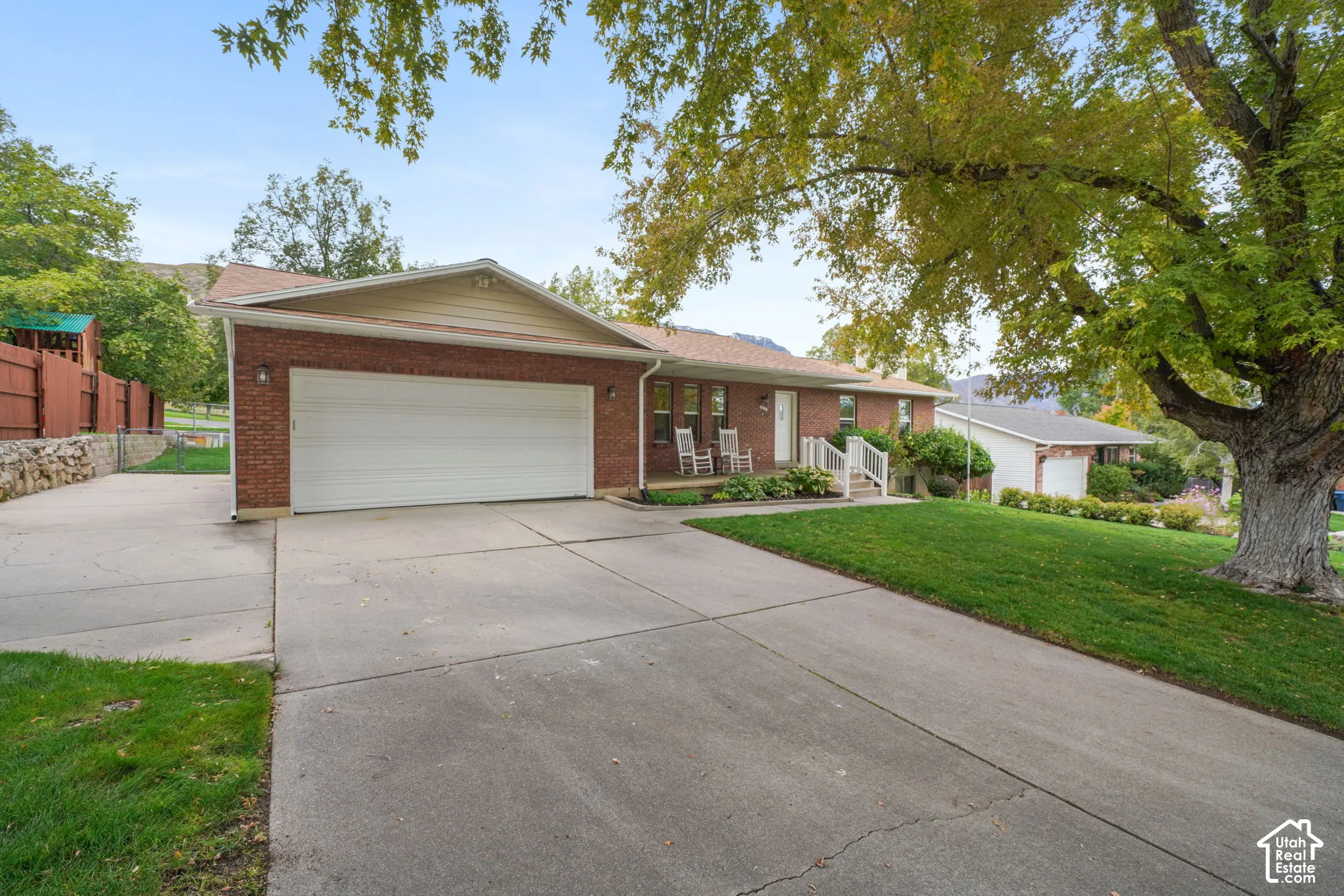 Driveway, attached 2 car garage, and RV parking