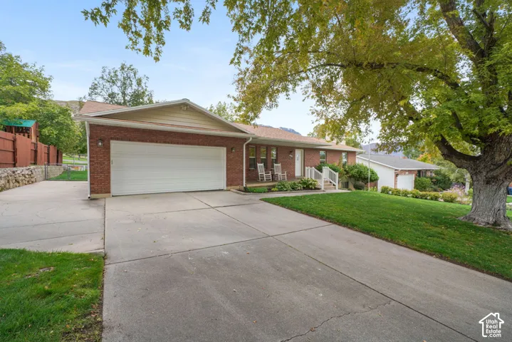 Driveway, attached 2 car garage, and RV parking