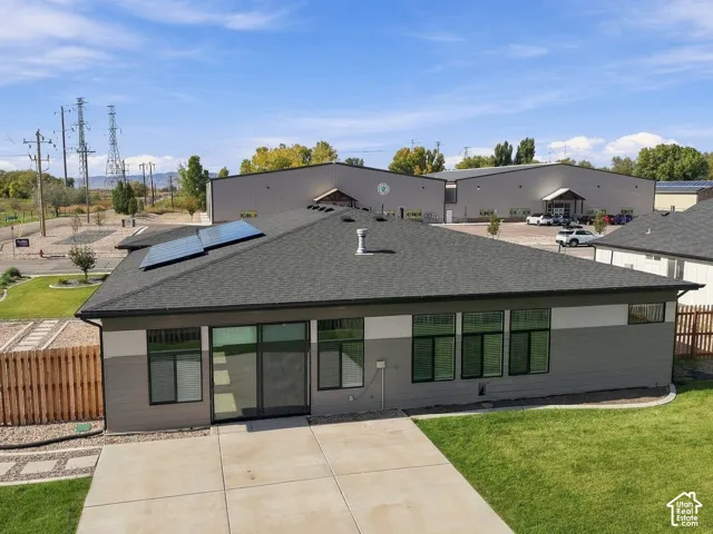 Single-story exterior featuring a grey lap siding fa