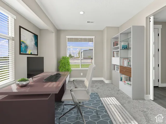 Built-in floor-to-ceiling shelving unit, neutral wall color, recessed lighting, and dual windows