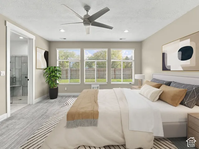 Neutral-toned interior featuring wood-finish flooring, a contemporary ceiling fan, recessed lighting, and a set of three windows