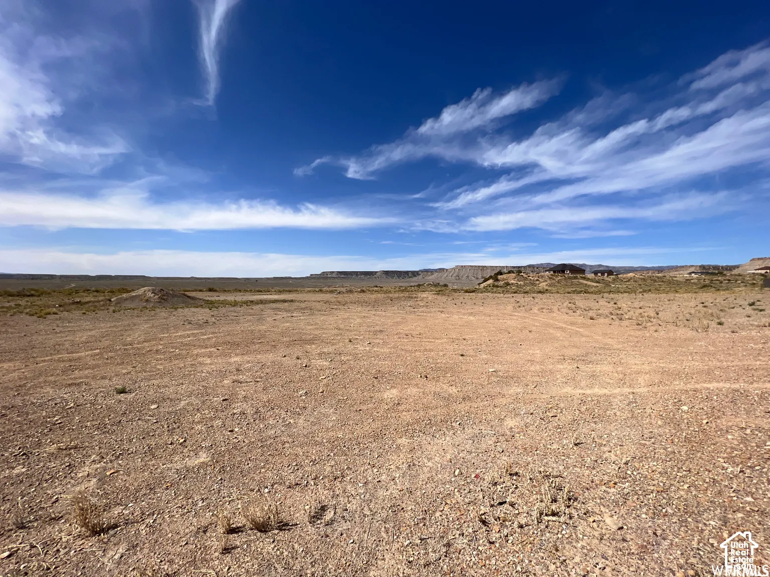 Expansive unimproved lot featuring desert terrain and prominent mesa formations