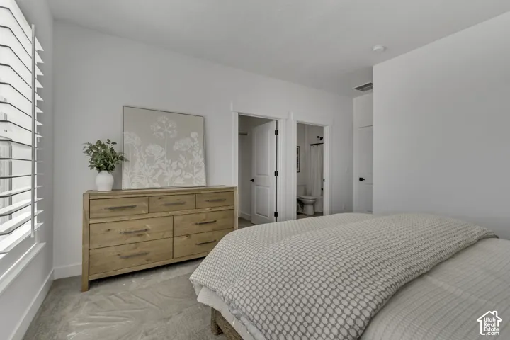 Neutral interior featuring high-pile carpeting, custom white plantation shutters, and solid-core interior doors with matte black hardware
