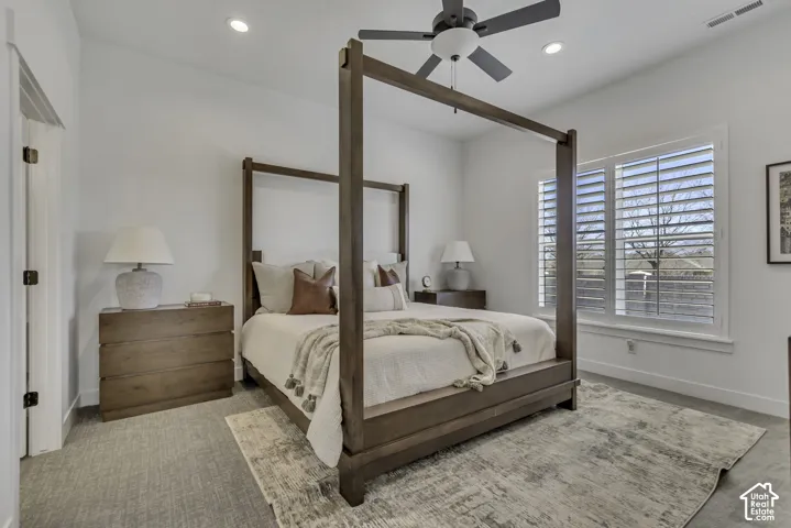 High-ceiling room featuring recessed lighting, a modern ceiling fan, and plantation shutters