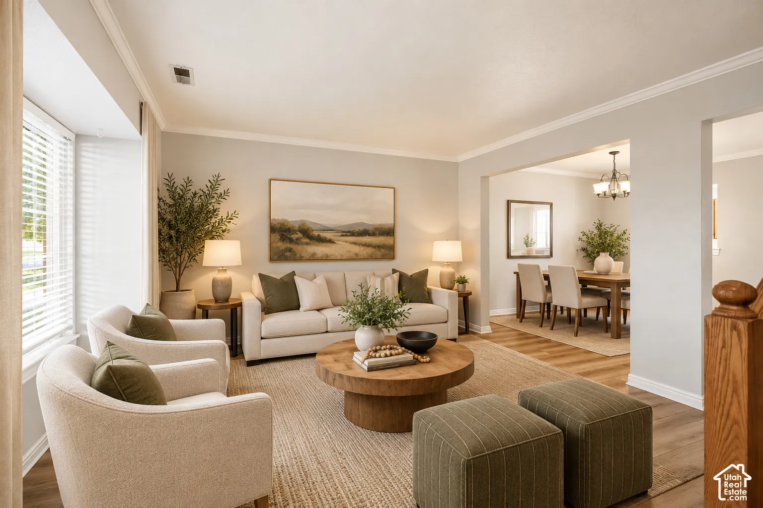 Living area featuring a bay window, wood-finish flooring, and crown molding