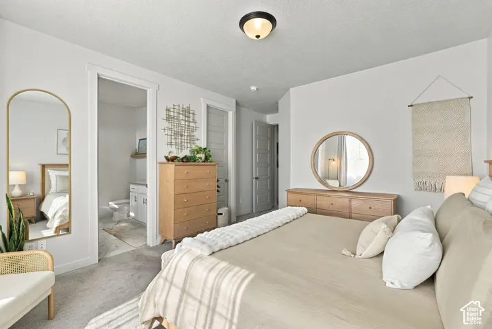 Neutral-toned interior featuring plush carpeting, crisp white walls, five-panel interior doors, and a flush-mount dome light fixture