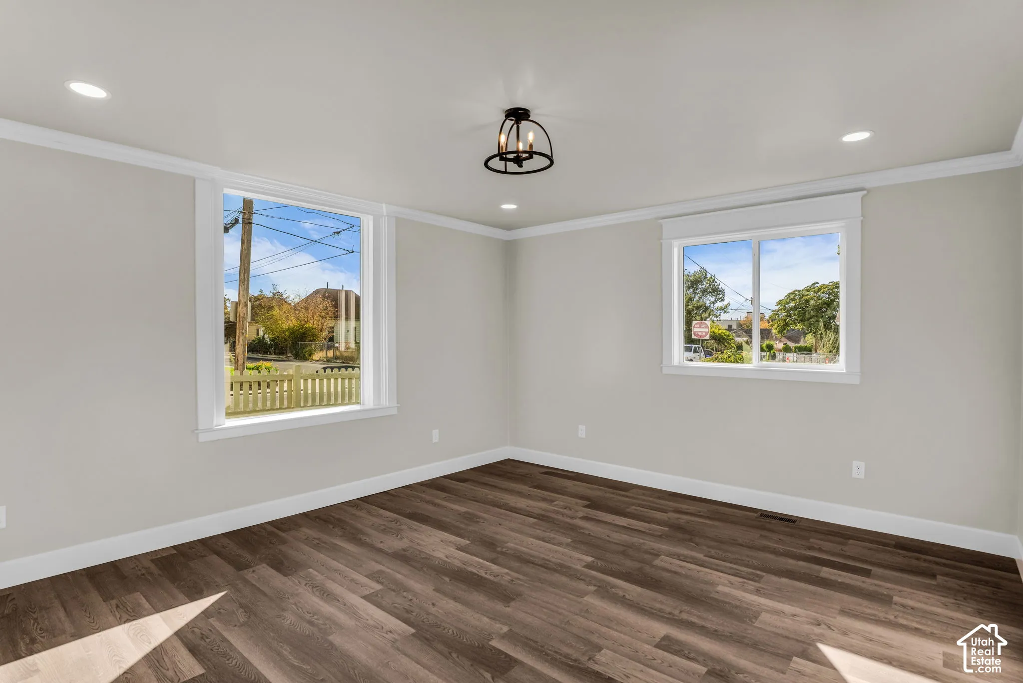 Wood-finish flooring with crisp white trim throughout