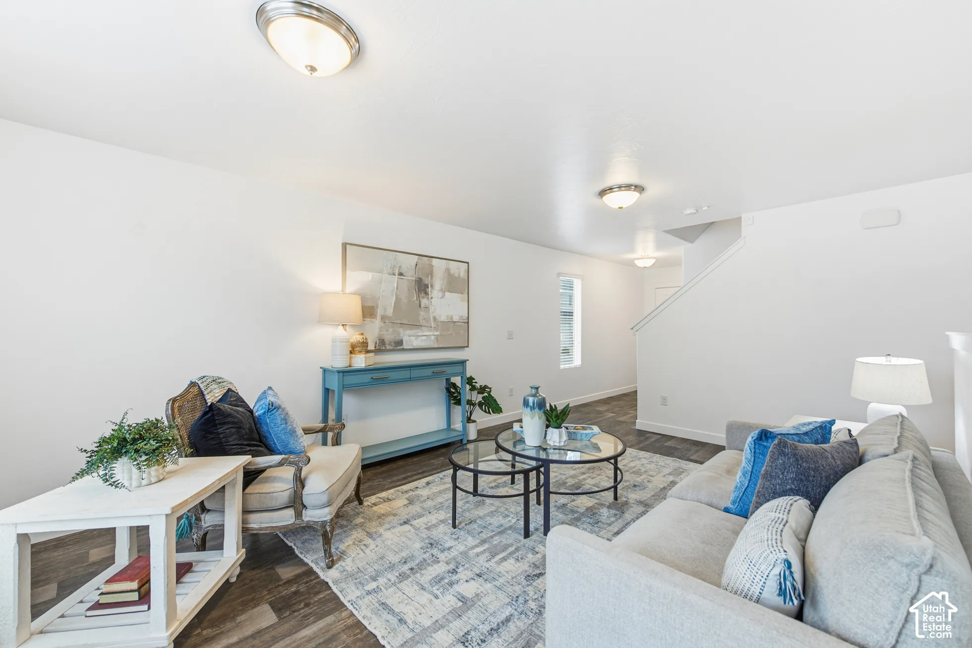 Interior space featuring neutral wall paint, wood-finish flooring, and recessed ceiling lighting
