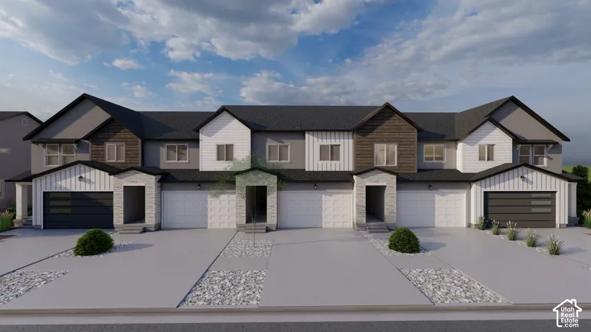 Multi-unit residential exterior featuring a mix of horizontal lap, vertical board-and-batten, and wood-finish siding, stone masonry accents, multi-gabled rooflines, and private garages