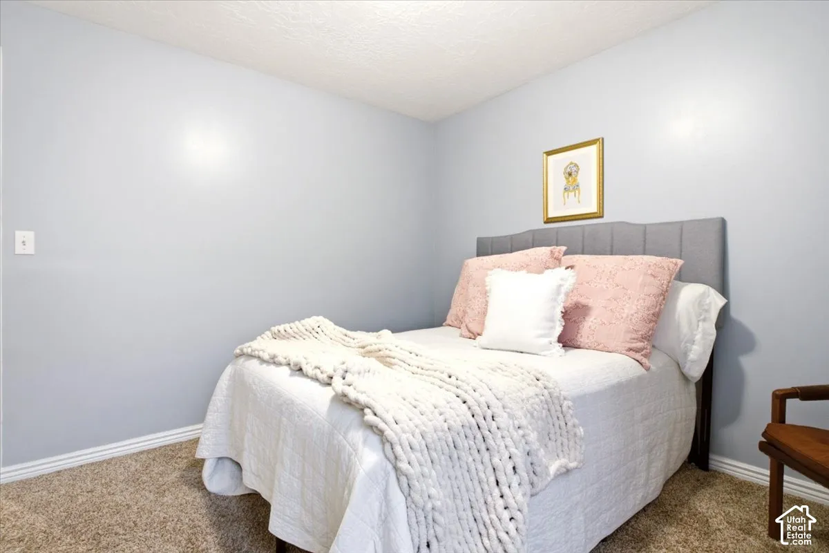 Neutral wall tones and wall-to-wall carpeting