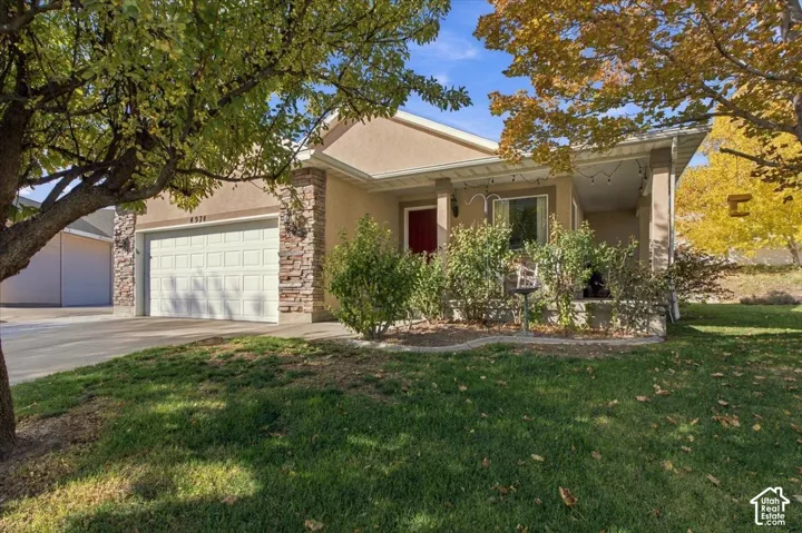 Updated Riverton home on a quiet cul-de-sac with mature trees, a covered front porch, and no HOA.