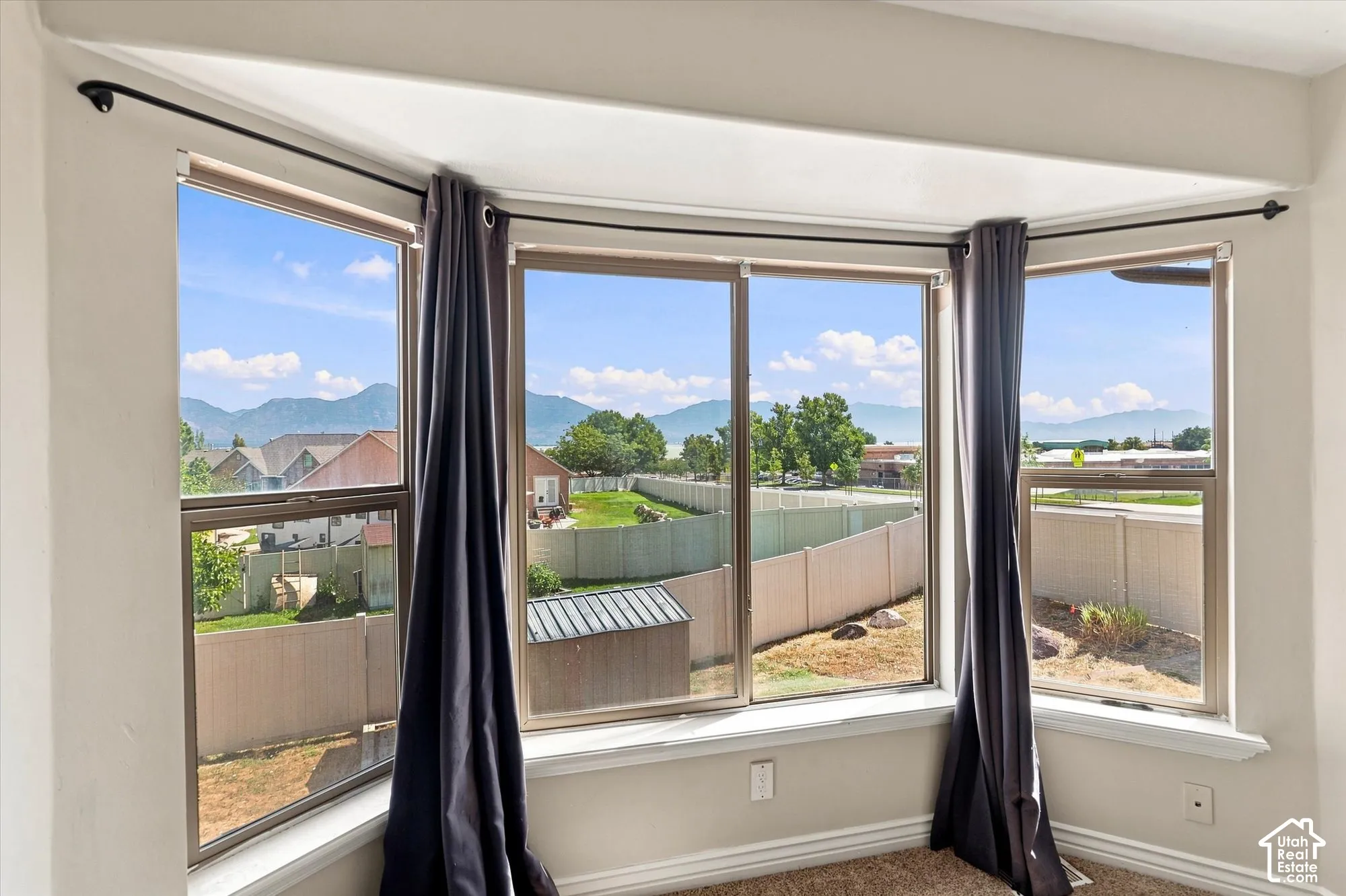 Bay window featuring multi-pane glass and mountain range scenery