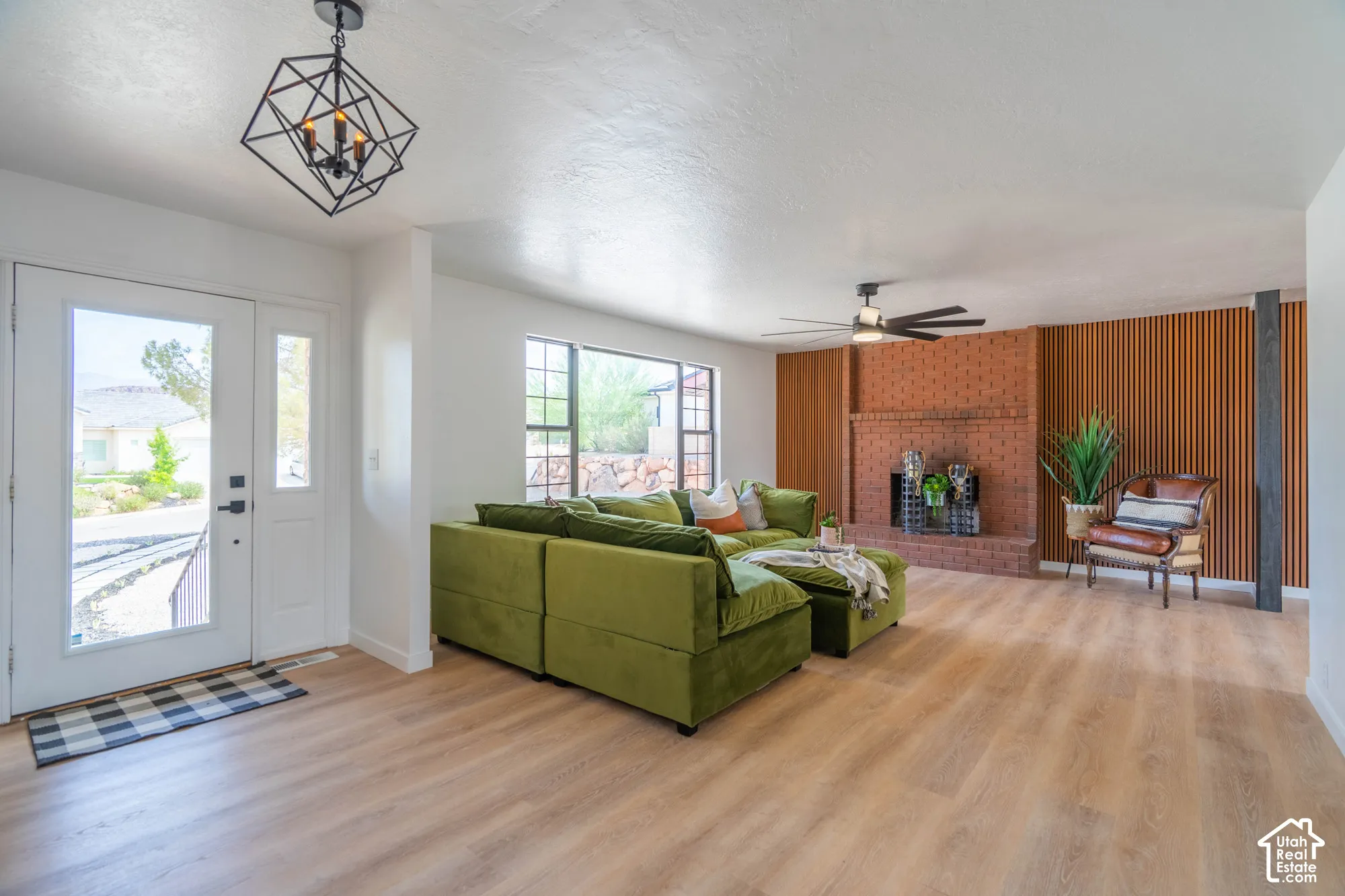 Light wood-finish flooring complements the white walls