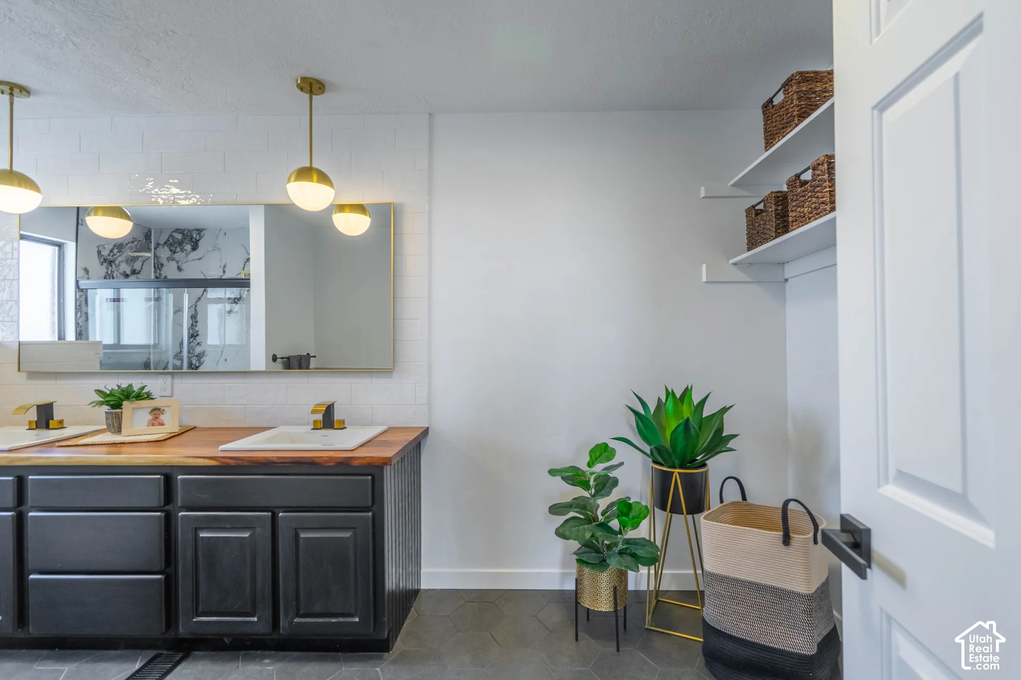 Dual vanity with wood-finish countertop, white rectangular vessel sinks, and brass-tone fixtures