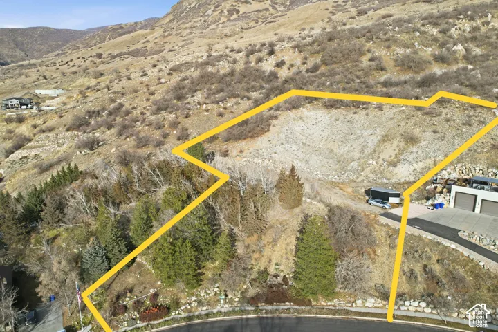 View of rural area featuring a mountain backdrop and property parcel outline