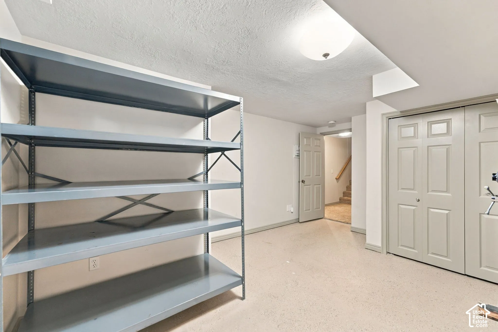 Currently used as a storage room, this would make a perfect 6th bedroom complete with closet and full egress window.