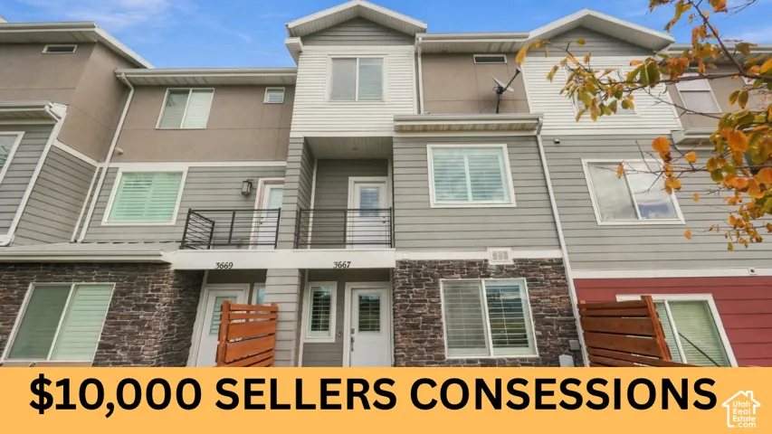 Multi-story townhouse exterior featuring a combination of horizontal lap siding, vertical paneling, and stone veneer masonry, accented by metal balcony railings and privacy screening