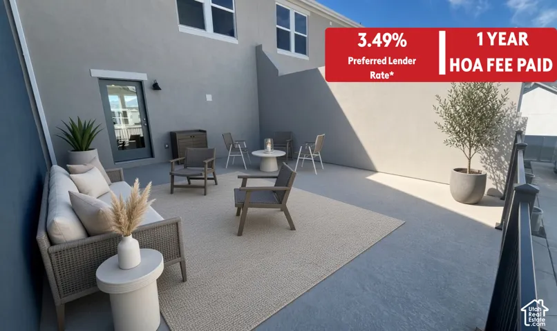 Expansive rooftop patio featuring smooth concrete flooring, privacy-enhancing perimeter walls, and a decorative metal railing
