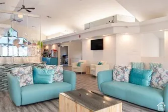 Wood-finish flooring throughout, complemented by a textured accent wall