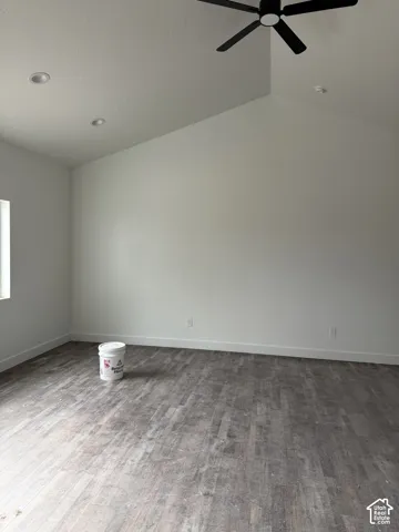 Vaulted ceilings featuring recessed lighting and a matte black ceiling fan, paired with wood-finish flooring
