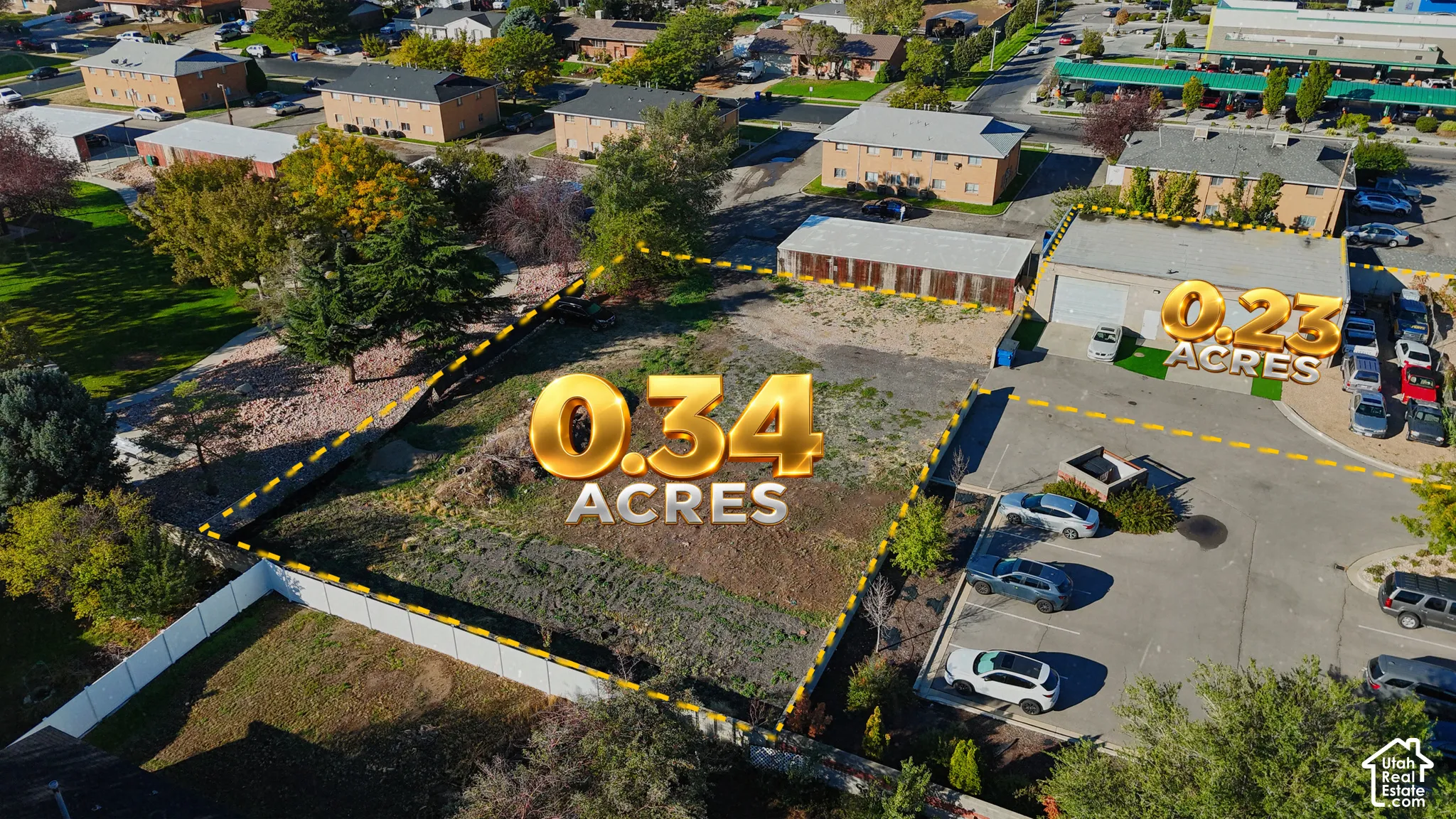 Cleared lot measuring 0.34 acres featuring partial perimeter fencing and mature trees