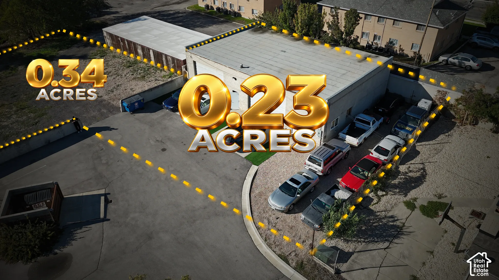 Commercial property featuring a flat-roof structure, asphalt paving, gravel surface, and dedicated exterior storage area