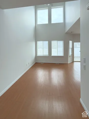 Vaulted ceilings, multi-level windows, and wood-finish flooring